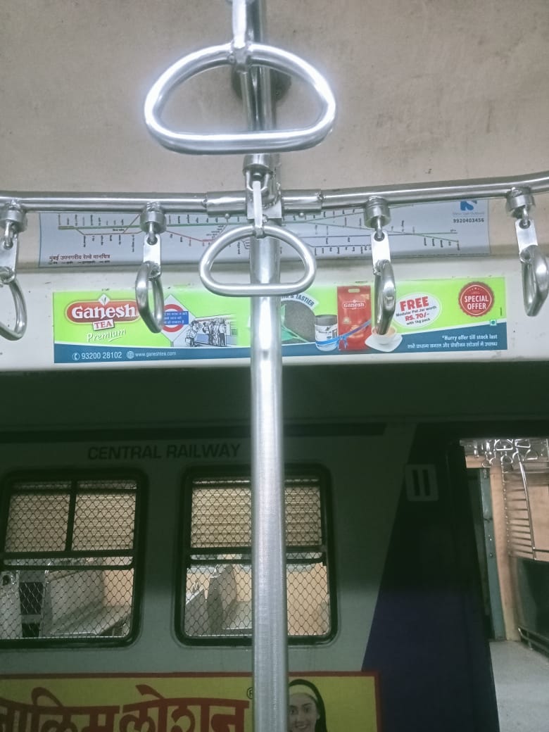 Inside train routemap header panel advertisement inside a suburban train