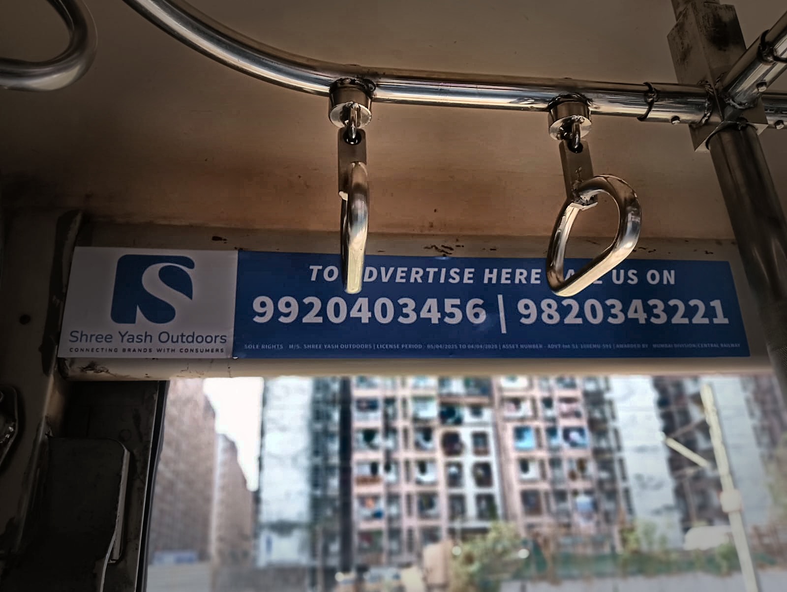 Commuters boarding a branded suburban train