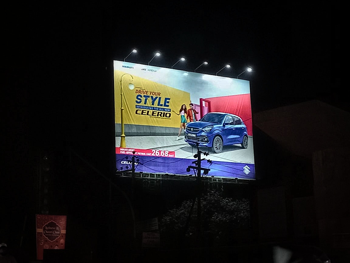 Night-illuminated highway billboard on arterial expressway
